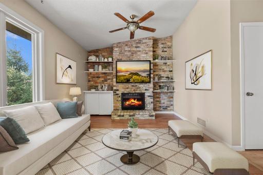 Virtually staged main floor family room with gorgeous fireplace
