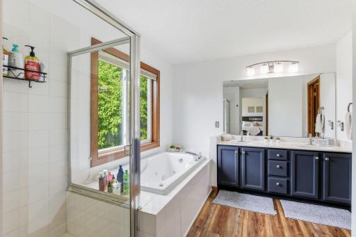 Master bathroom with a jetted tub, separate walk-in shower, double vanities -18546-85th-Ave-N-26.jpg