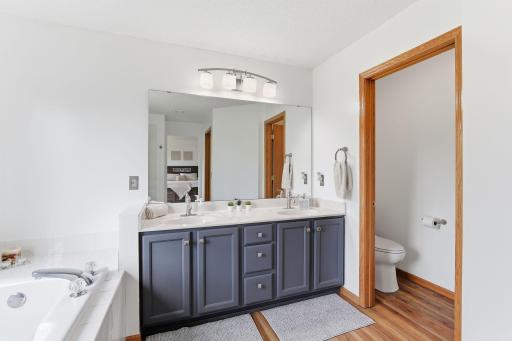 Master bathroom with a jetted tub, separate walk-in shower, double vanities -18546-85th-Ave-N-27.jpg
