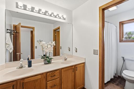 A full bathroom with double vanities on upper level-18546-85th-Ave-N-31.jpg