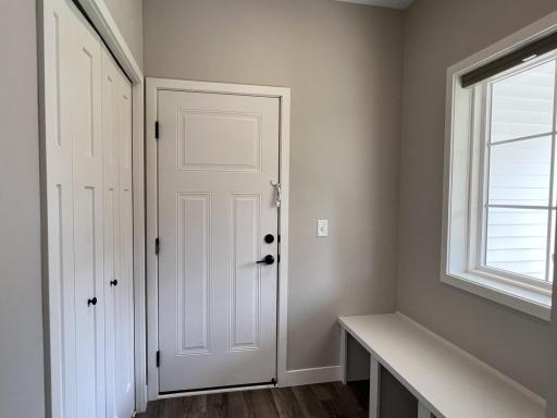 Entrance from garage with built-in bench