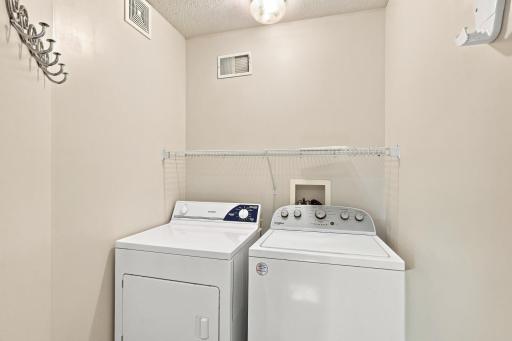 Convenient upper level laundry with new washing machine (2025).