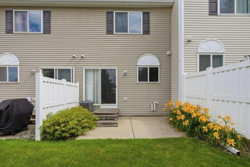 Private & cozy back patio space overlooking the wooded area behind the home.