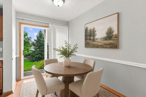 Informal dining space with patio views *Photo has been virtually staged for illustrative purposes