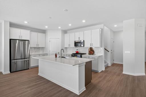 Bright white cabinets and fridge already installed