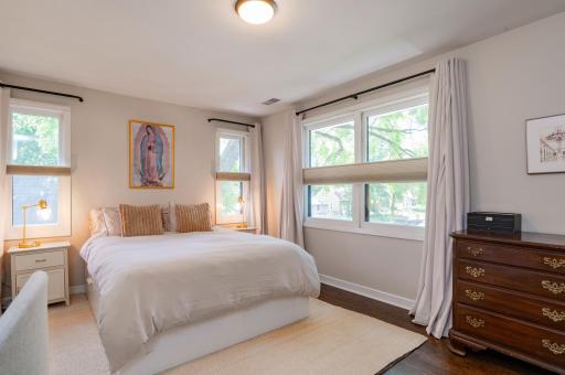 The primary bedroom has tons of large windows to fill this room with natural light.