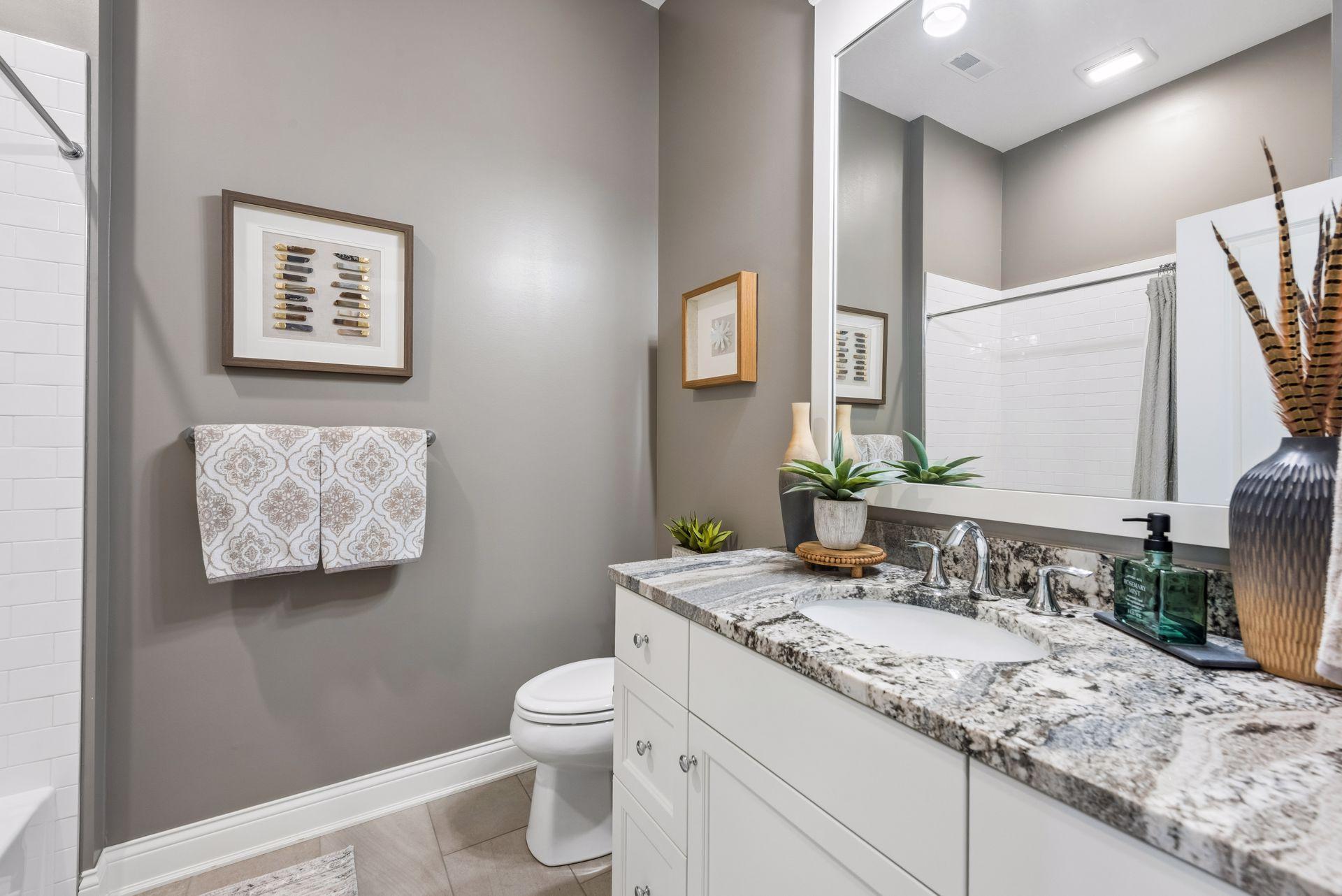 The second bathroom in your home that has a beautiful vanity and counter top!