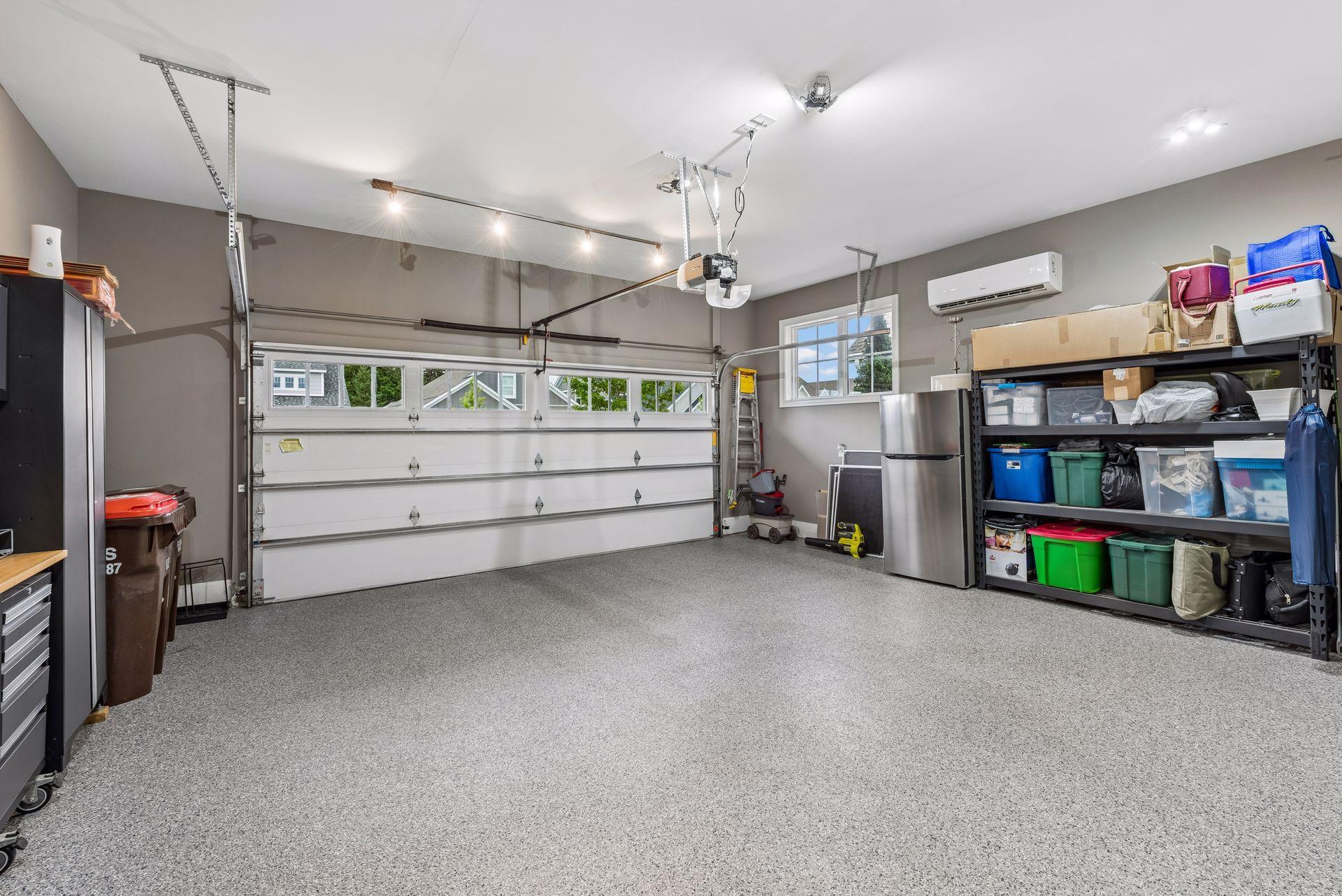 Storage galore possibilities in here. One of the cleanest garages.
