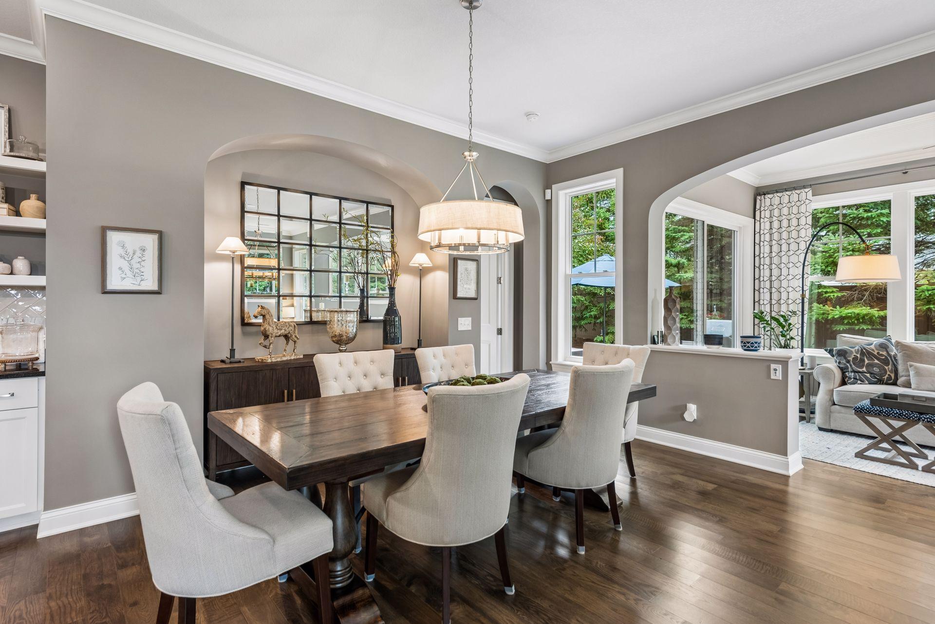 Dining area that is elegant and is highlighted by natural lighting in the surrounding areas.