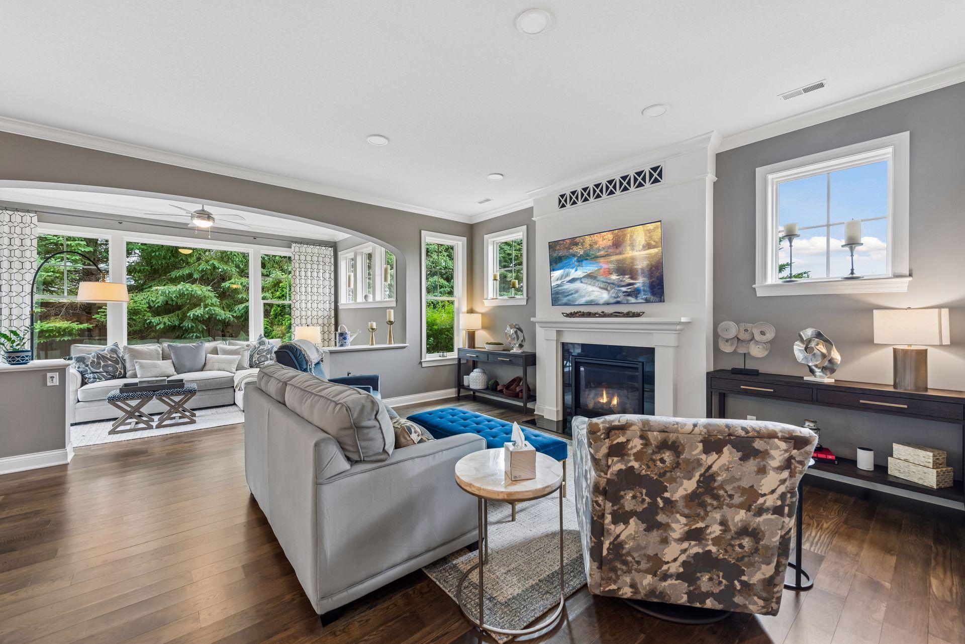 Living area with a sneak peak into your sunroom that boasts the entirety of the home.