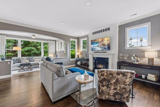 Living area with a sneak peak into your sunroom that boasts the entirety of the home.