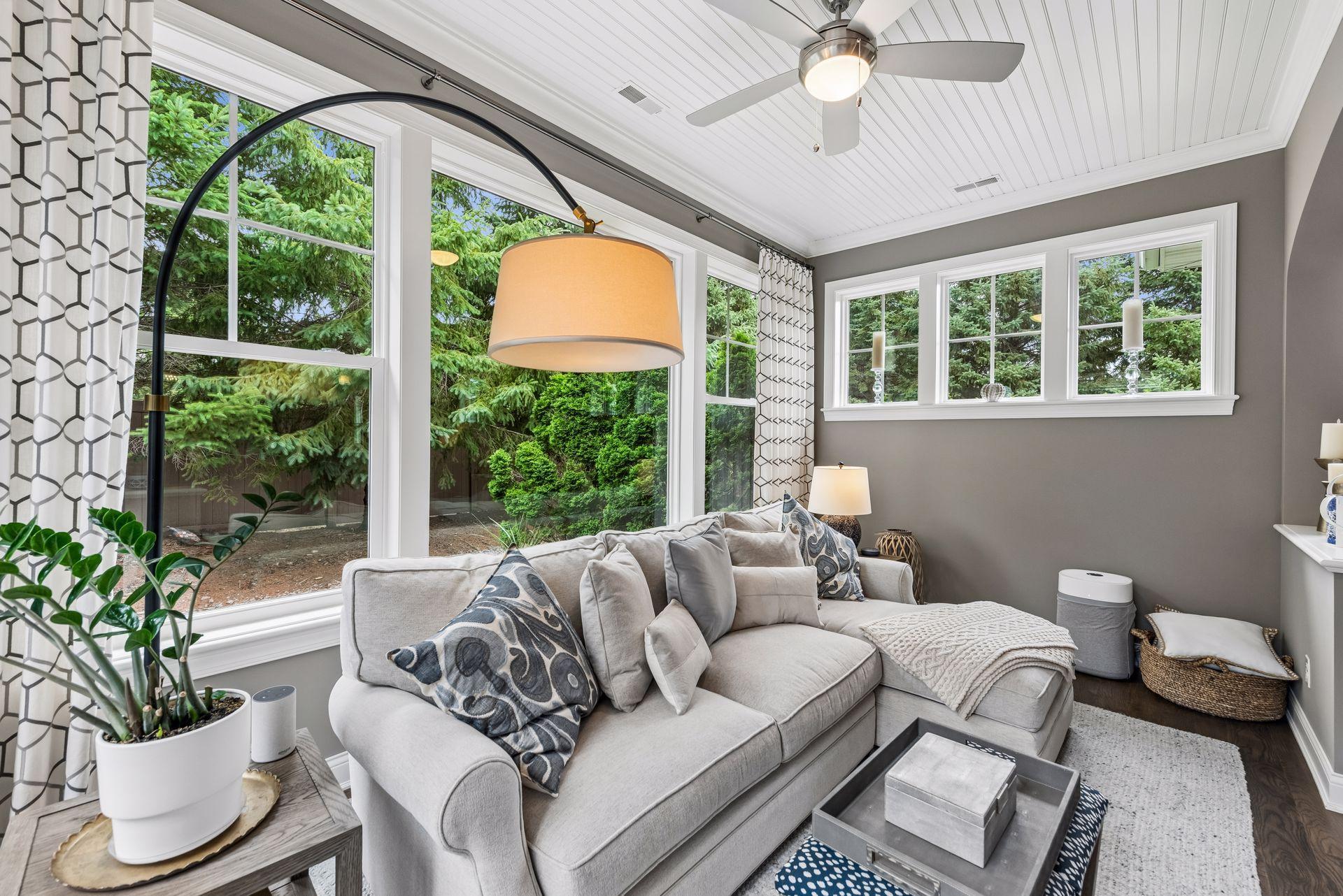 The sunroom is so cozy and beautiful. Views out the window to your yard and patio while the other direction is views of your new beautiful home!