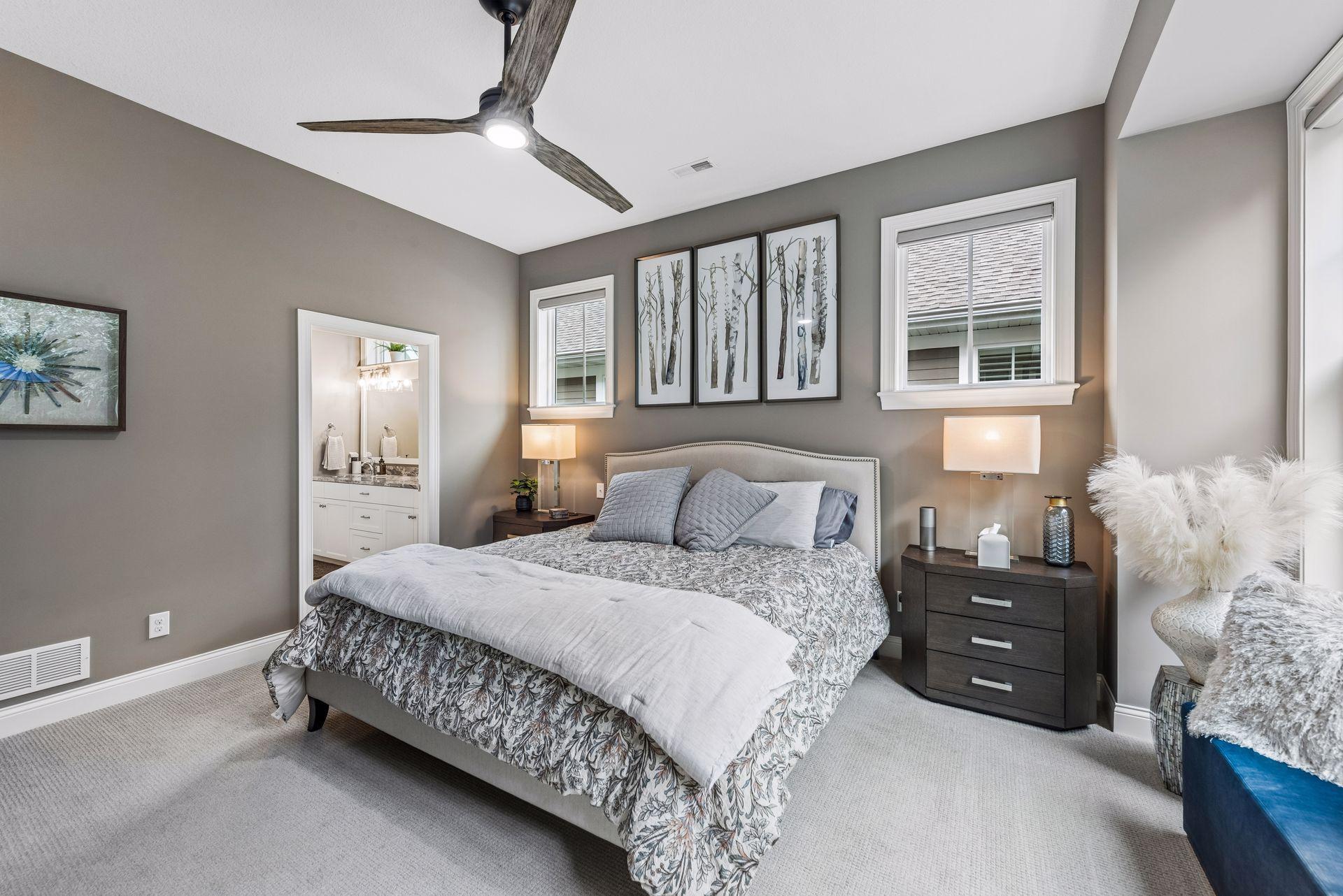 Primary bedroom that is boasted by natural lighting.