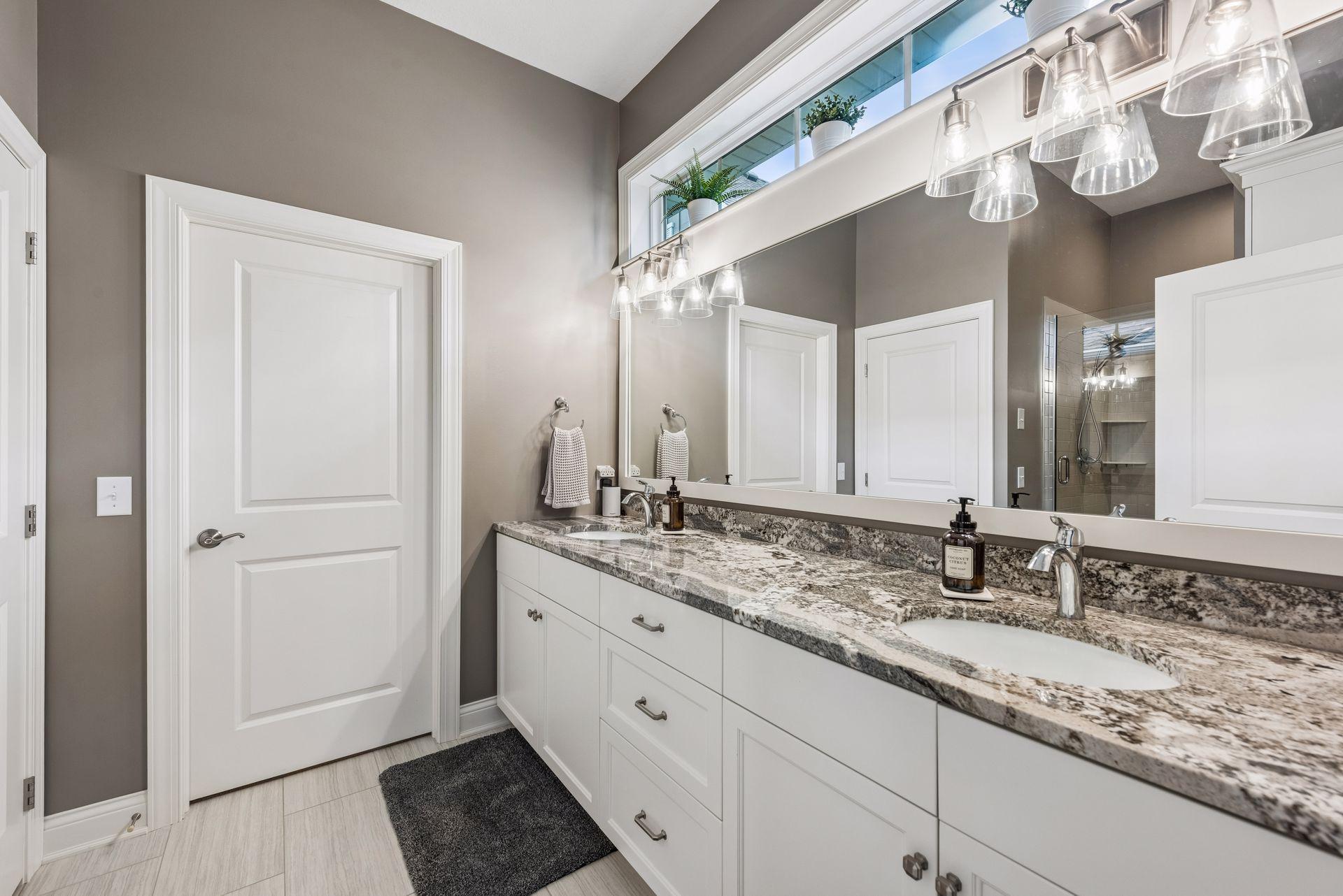 Double sink and vanity in your primary bathroom. A lot of countertop space for your bathroom necessities. The bathroom has heated floors as well!