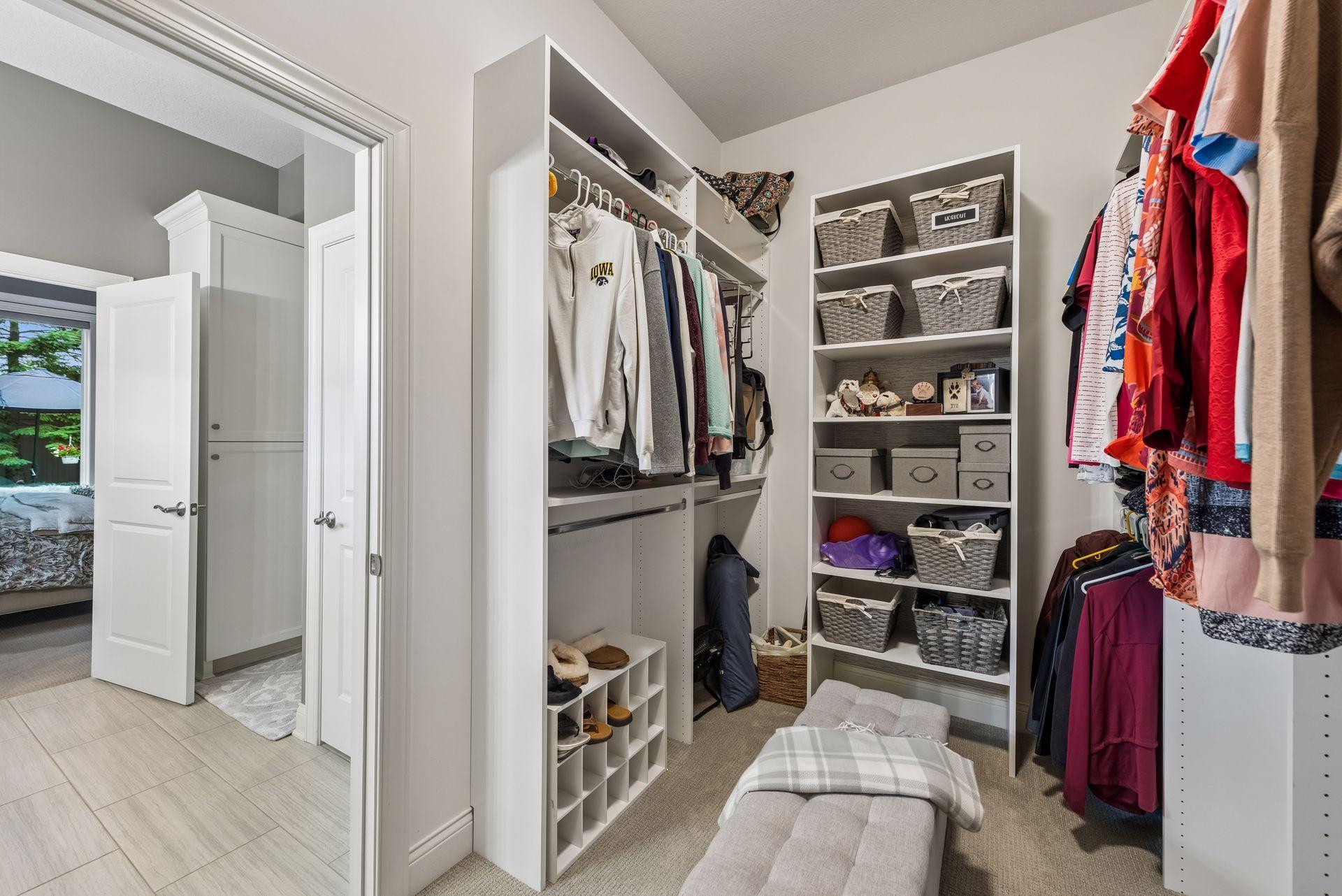 Amazing walk-in closet with built-ins and organization tactics to place your clothing and other storage!