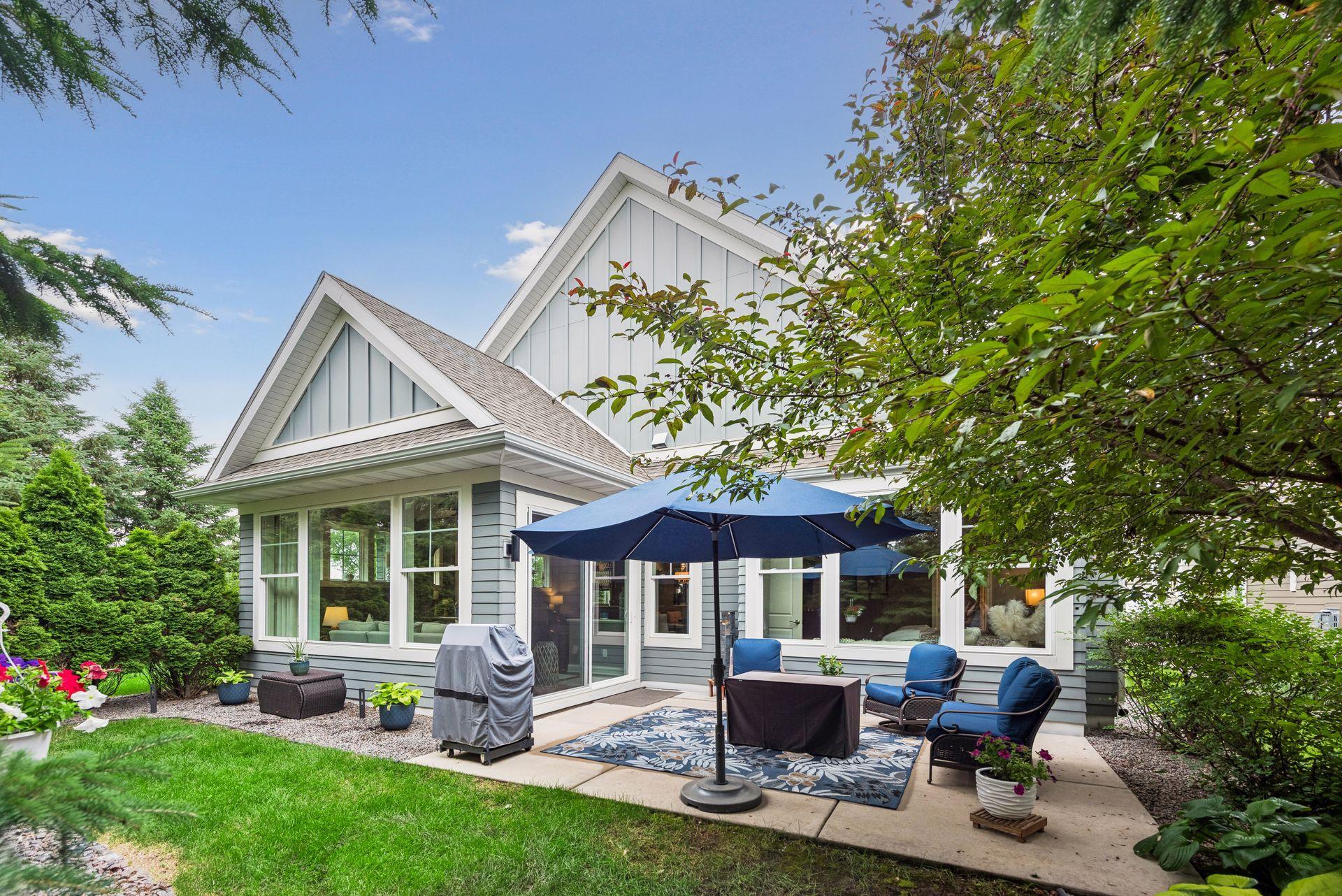 Back view of your home with the patio. Glorious landscaping and seating area.
