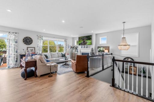 The staircase has a beautiful chandelier and the railings were an upgrade. The living room has a gas fireplace.