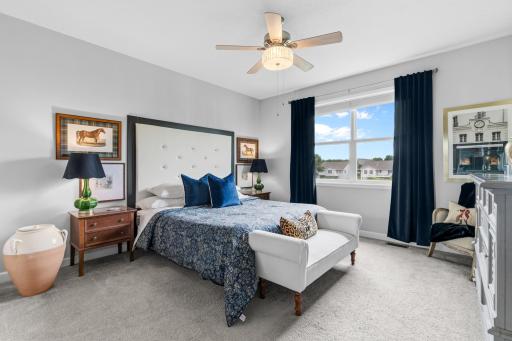 The primary bedroom suite has a custom attached headboard.