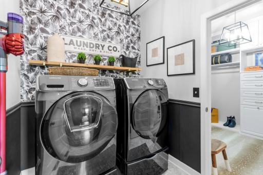 The main level laundry room can also be accessed through the hallway.