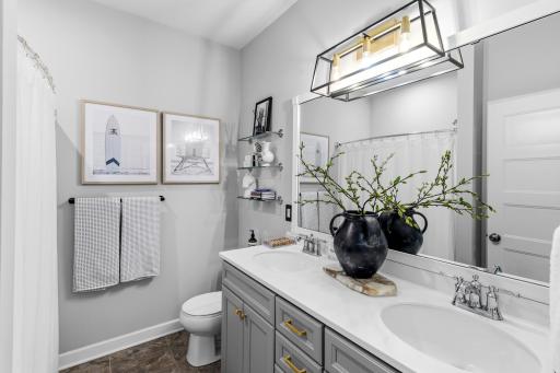 The main level full bath that is located near the front entry and between bedroom #2 and the office (bedroom #3).