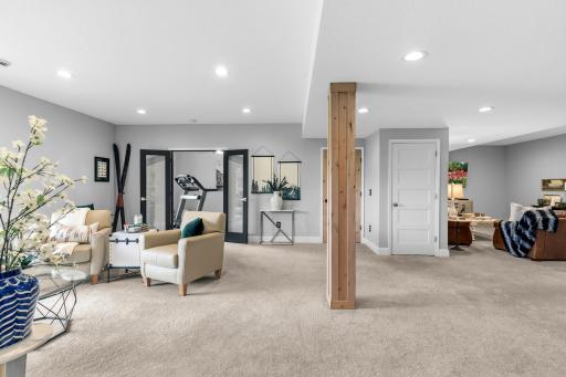 Family room #1 is on the left, the white door is to the stairway and family room #2 is on the right.