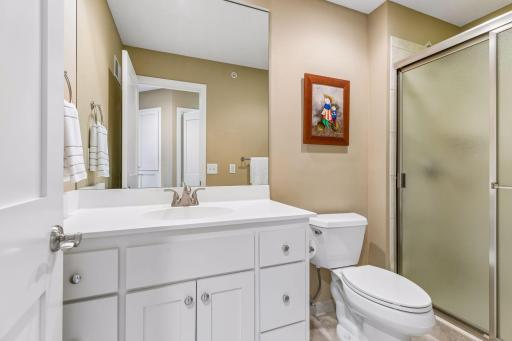 A full bathroom on the upper floor supports Bedrooms 2 and 3. It's neutral palette allows the next homeowner to inject their own color scheme.