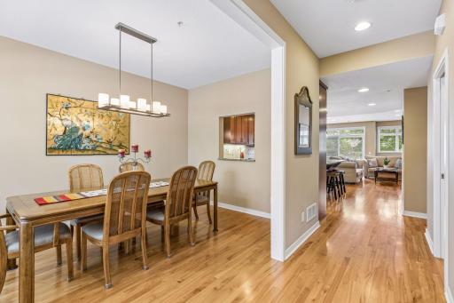 Standing in the entrance foyer, you can see past the dining room/flex space towards the great room and kitchen