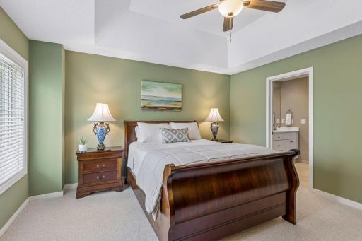 An en suite bath and walk-in closet are connected to the primary bedroom.