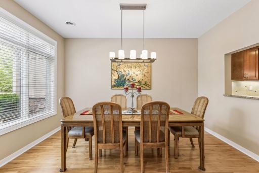 The first room you encounter as you enter the home is a flex space that can be furnished as a formal dining room (as shown), den or office. The pass-through on the east wall connects to the kitchen.