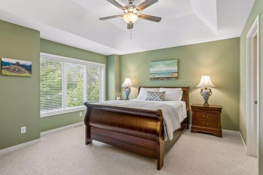 At the top of the stairs is the spacious primary bedroom suite which faces east.