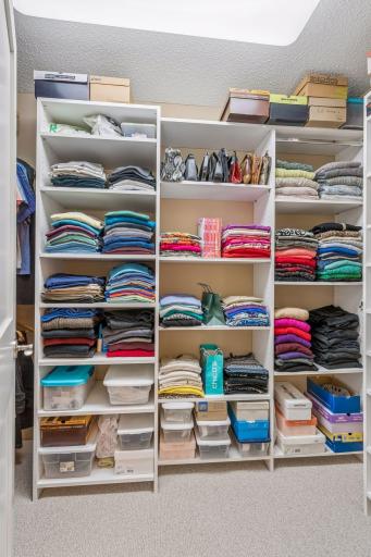 One of four walls inside the custom-designed primary closet.