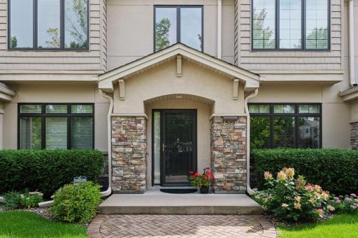 The beautiful interlocking brick sidewalk adds warmth and elegance to the home