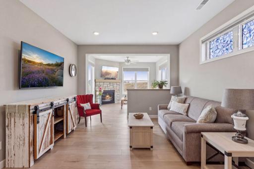 Inviting living room leading to warm fireplace retreat