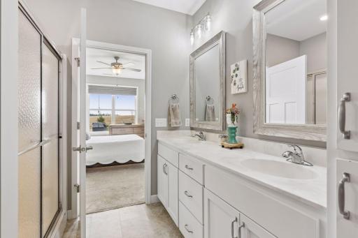 Private primary bath featuring dual sink vanity