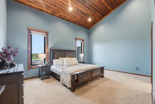 A private owner's retreat featuring soaring vaulted ceilings and a spa-inspired bath designed for comfort and relaxation.