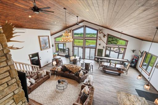 Designed for gathering and built to endure, the custom lodge blends modern luxury with timeless craftsmanship. Beyond its walls lie established food plots, strategically placed deer stands, a stocked pond, winding river frontage and beach.