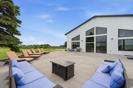 Walls of Anderson windows and the expansive patio create the perfect setting for indoor-outdoor entertaining