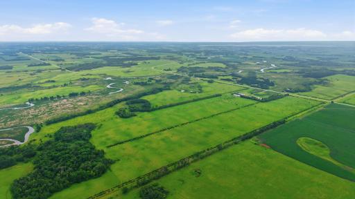 Years of meticulous habitat management have transformed this property into a premier sporting estate featuring established food plots, strategically positioned deer stands, mature timber, native grasslands, a stocked pond, & river frontage