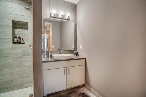 The designer Â¾ bathroom is conveniently situated near the second bedroom.