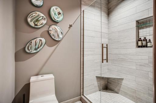 The designer Â¾ bathroom is conveniently situated near the second bedroom.