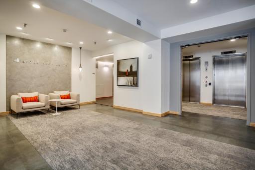 Elevator access in the lobby leads to underground parking levels, exercise room, rooftop deck and party room.