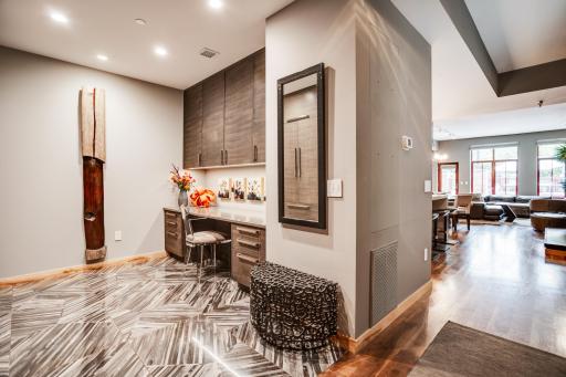 The main level includes a den that could flex as an office and/or guest space.