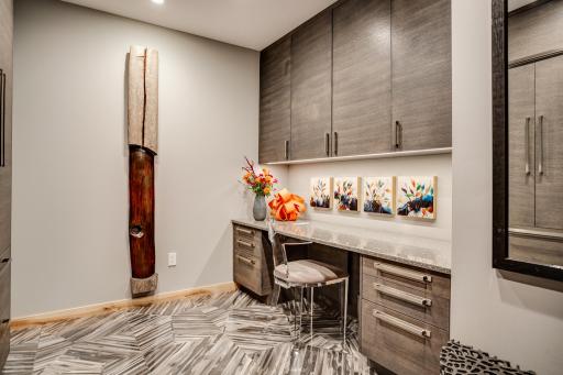 The main level includes a den that could flex as an office and/or guest space.