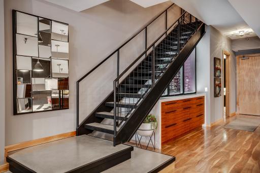The modern industrial staircase is a nod to the area's history.