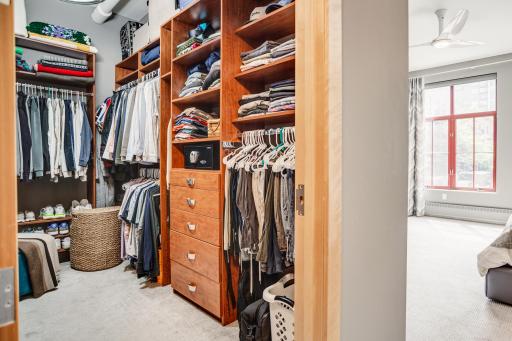 The primary bedroom walk-in closet offers plentiful storage space.