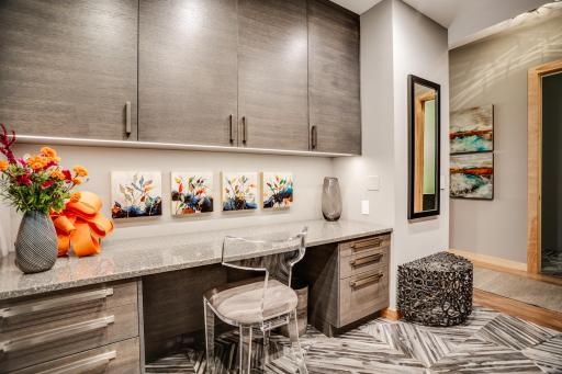The main level includes a den that could flex as an office and/or guest space.