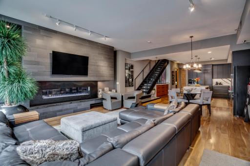 The linear gas fireplace acts as functional art with temperature controls and dramatic lighting.