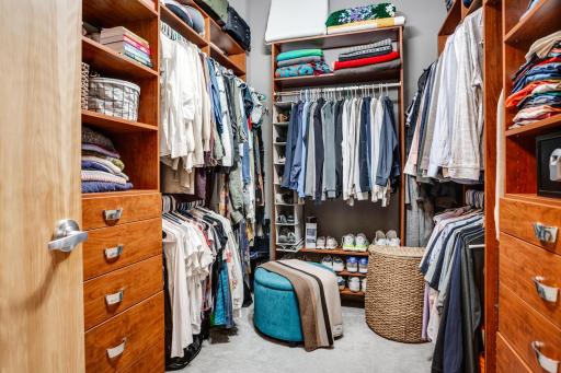 The primary bedroom walk-in closet offers plentiful storage space.