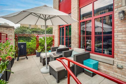 The living room has direct access to the private gated patio, wonderful for indoor-outdoor living in the heart of the city.