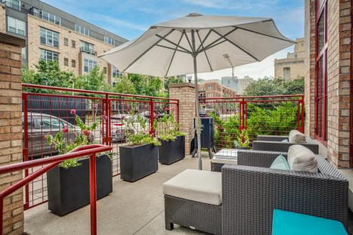 The living room has direct access to the private gated patio, wonderful for indoor-outdoor living in the heart of the city.